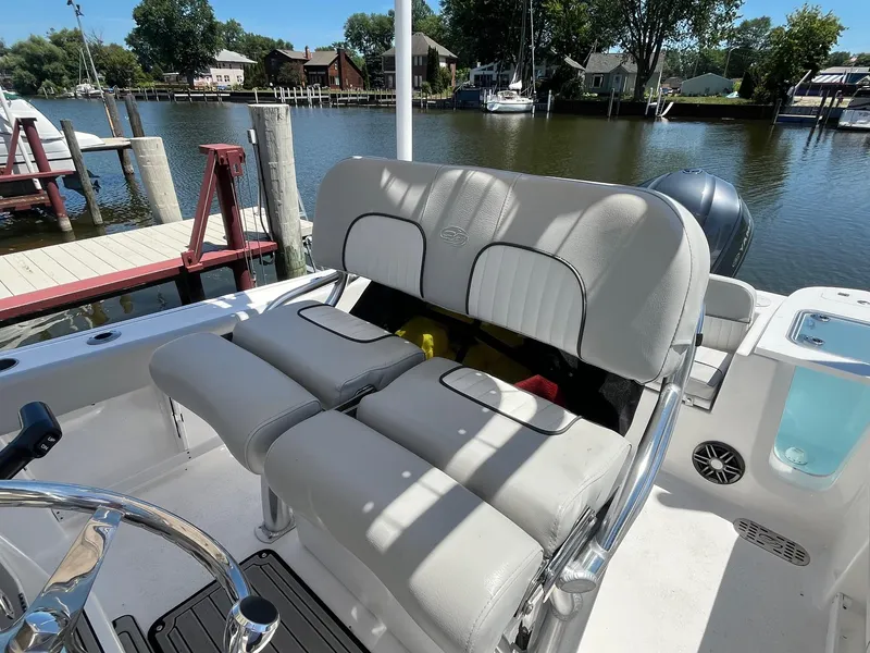 Slide: The Image of 2023 Sea Fox 248 Commander boat interior with cushioned seating and waterfront view. - 14