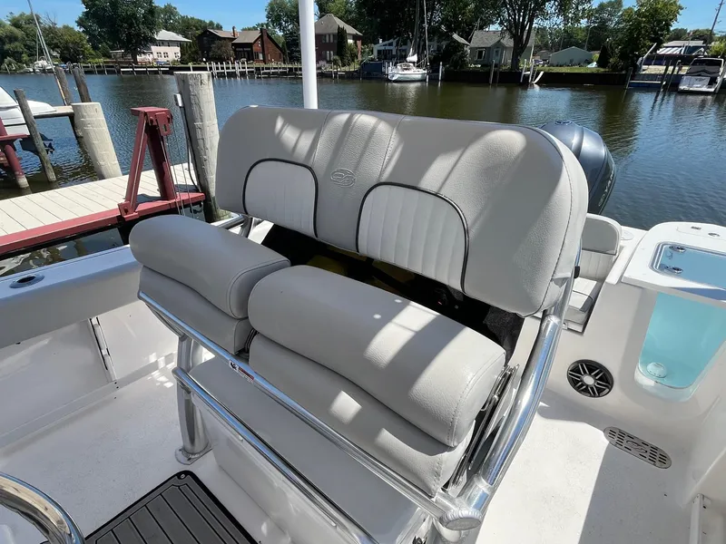 Slide: The Image of 2023 Sea Fox 248 Commander boat interior with cushioned seating by the water. - 15