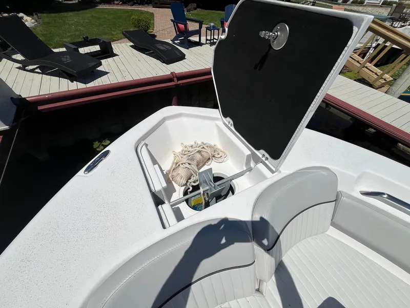 Slide: The Image of 2023 Sea Fox 248 Commander boat with open storage compartment and anchor. - 17