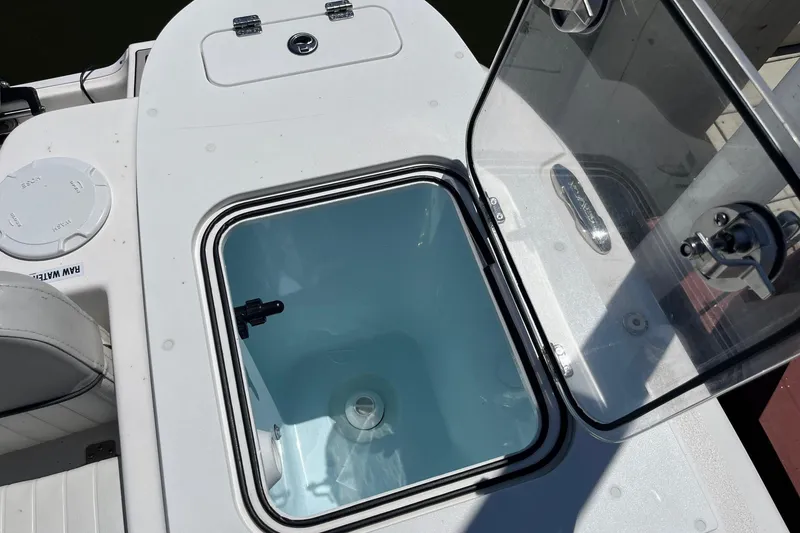 Slide: The Image of 2023 Sea Fox 248 Commander boat livewell with open lid, showcasing interior details. - 19