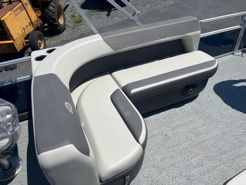 Slide: The Image of 2026 Sun Tracker Bass Buggy 18 DLX pontoon boat seating area with gray upholstery. - 11