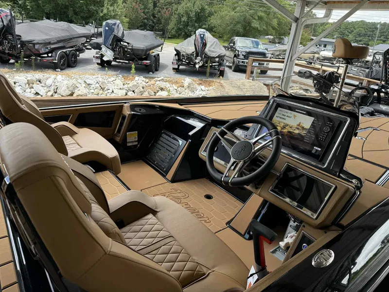 Slide: The Image of 2025 Ranger Z520R Cup-Equipped boat interior with advanced dashboard and luxurious seating. - 13