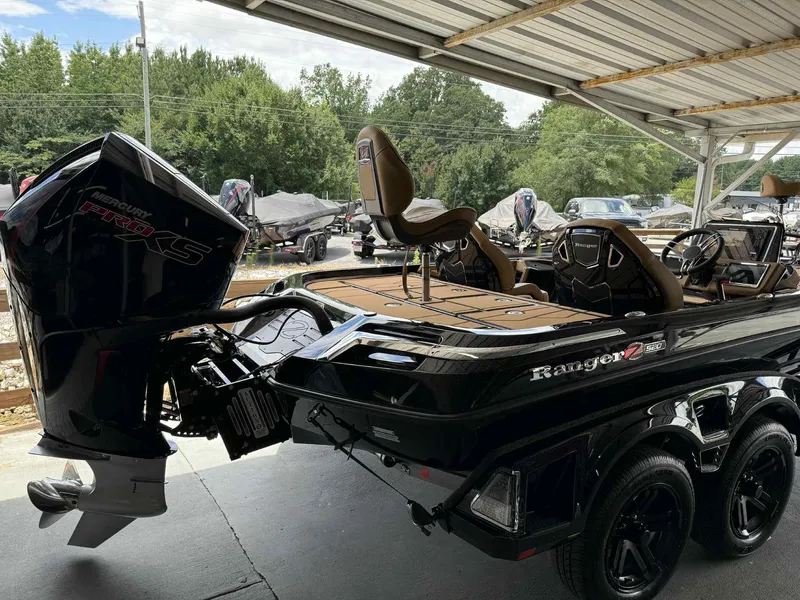 Slide: The Image of 2025 Ranger Z520R Cup-Equipped boat with Mercury Pro XS engine under a metal canopy. - 4