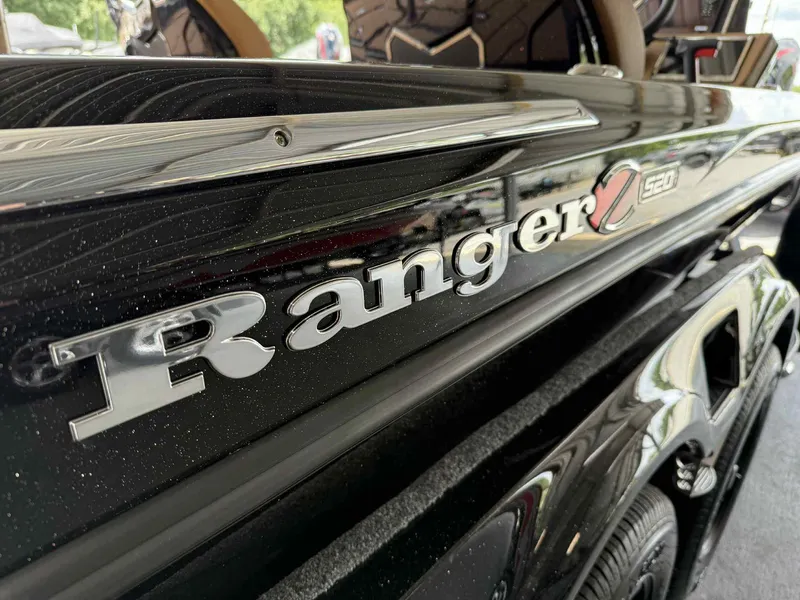 Slide: The Image of 2025 Ranger Z520R Cup-Equipped boat, close-up of logo and sleek black design. - 6