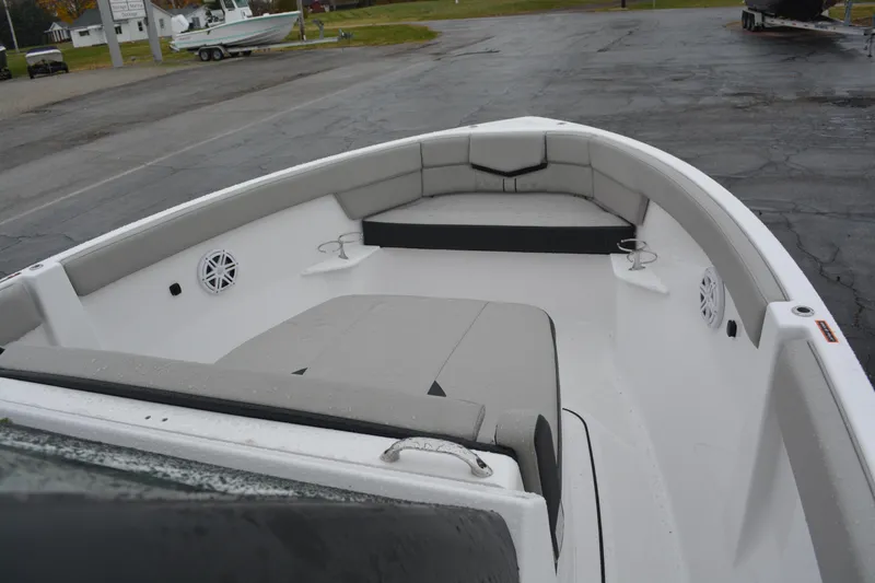 Slide: The Image of 2026 Monterey Elite 25 SD boat interior with gray seating and cup holders. - 14