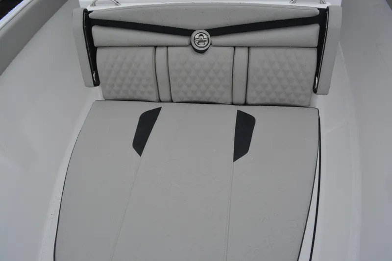 Slide: The Image of 2026 Monterey Elite 25 SD boat interior with cushioned seating and stylish design. - 15