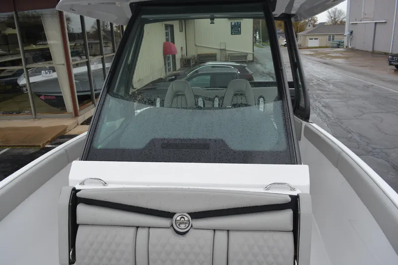 Slide: The Image of 2026 Monterey Elite 25 SD boat with sleek design and modern interior. - 16