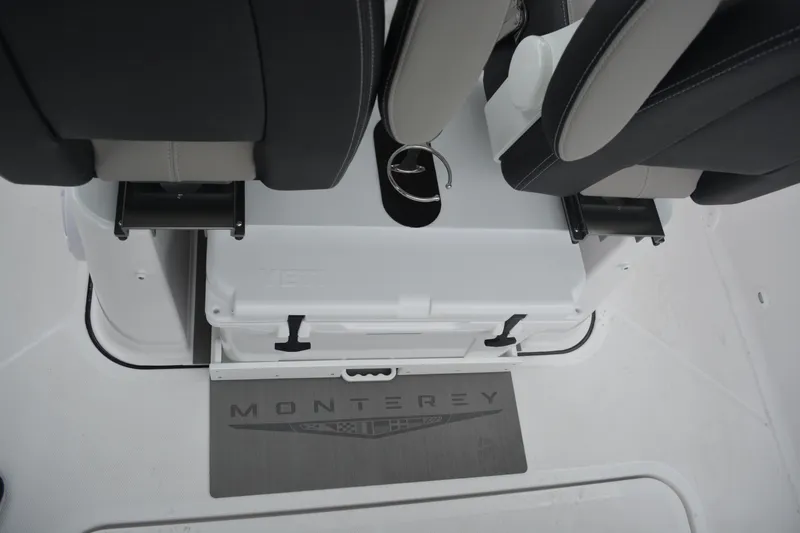 Slide: The Image of Interior of 2026 Monterey Elite 25 SD boat with seating and storage area. - 9