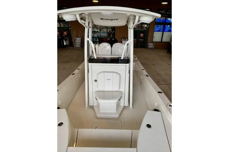 Slide: The Image of 2025 Ranger 2510 Bay boat interior with center console and seating. - 2