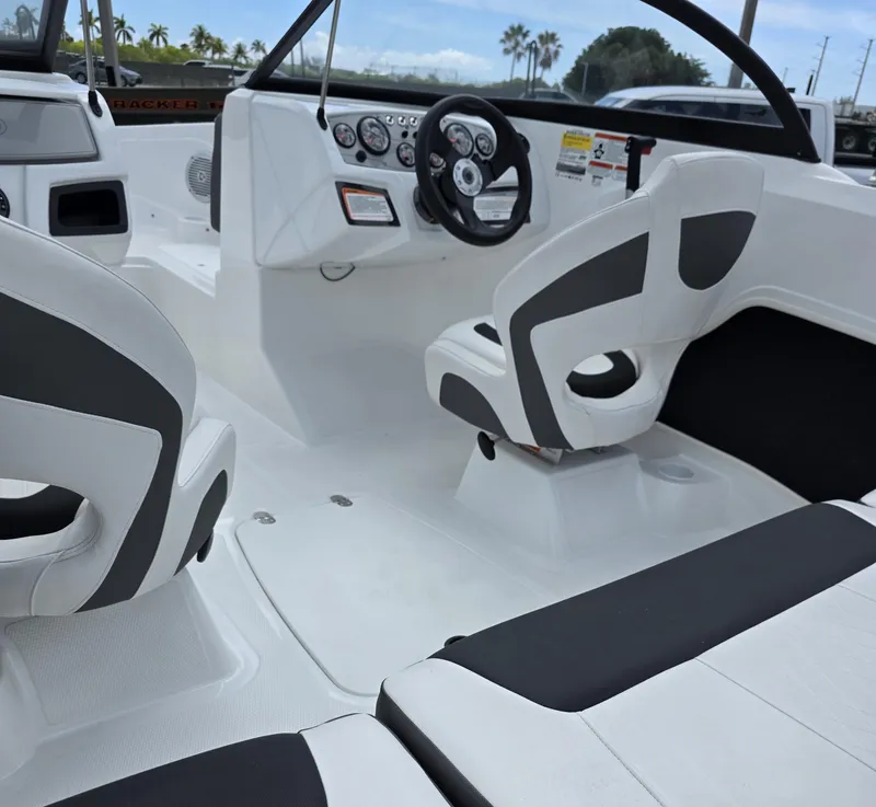 Slide: The Image of 2024 Tahoe 185 S boat interior with modern dashboard and seating. - 5