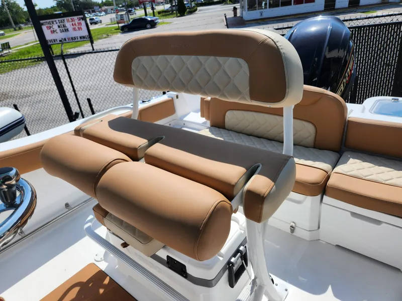 Slide: The Image of 2025 NauticStar 222 OSL boat interior with tan seating and modern design. - 6