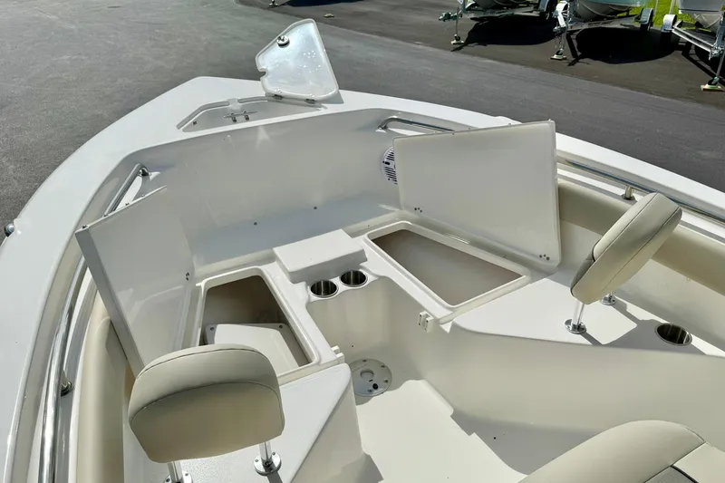Slide: The Image of 2025 Key West 203 FS boat interior with open storage compartments and seating. - 16