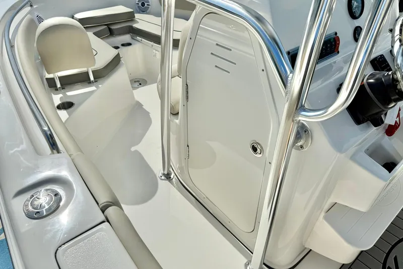 Slide: The Image of Interior of 2025 Key West 203 FS boat, featuring seating and control panel. - 22