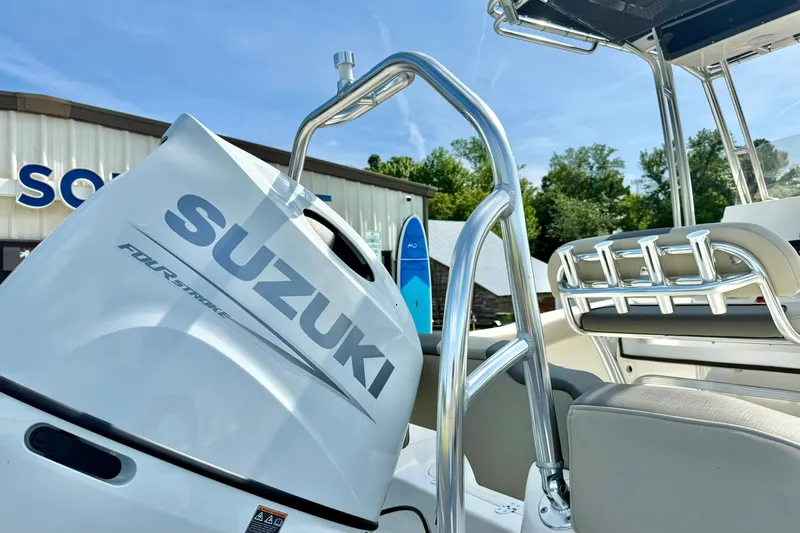 Slide: The Image of 2025 Key West 203 FS boat with Suzuki four-stroke engine, outdoor setting. - 28