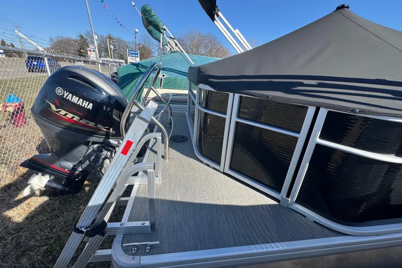 Slide: The Image of 2023 Sweetwater SW2086c pontoon boat with Yamaha outboard motor, docked outdoors. - 14