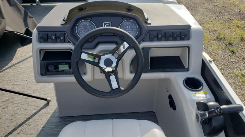 Slide: The Image of 2023 Sweetwater SW2086c boat dashboard with steering wheel and control panel. - 3