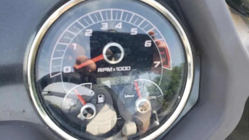 Slide: The Image of Close-up of a 2023 Sweetwater SW2086c tachometer displaying RPM and fuel gauge. - 4