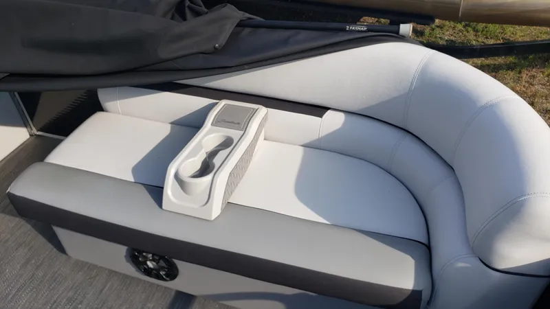 Slide: The Image of Sweetwater SW2086c 2023 boat seat with cup holder, featuring sleek gray upholstery. - 6