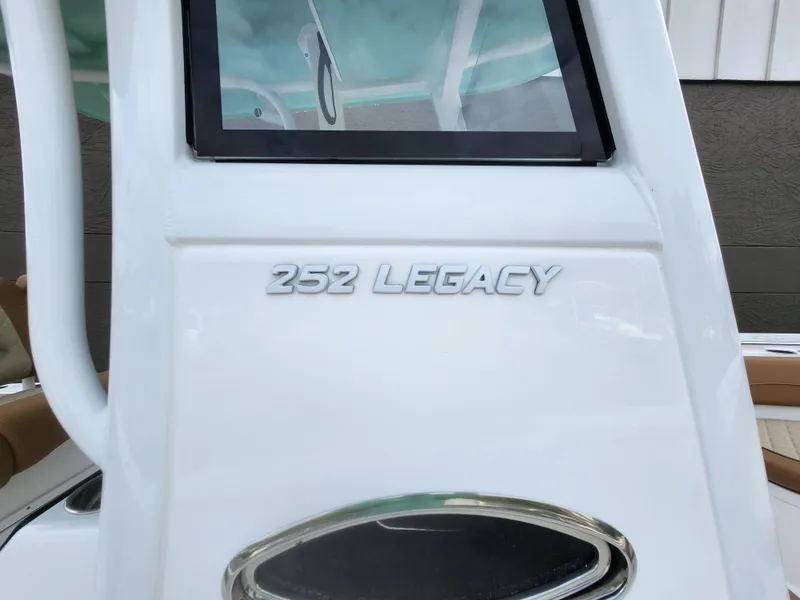 Slide: The Image of 2026 NauticStar 252 Legacy boat, close-up of model name on white surface. - 10