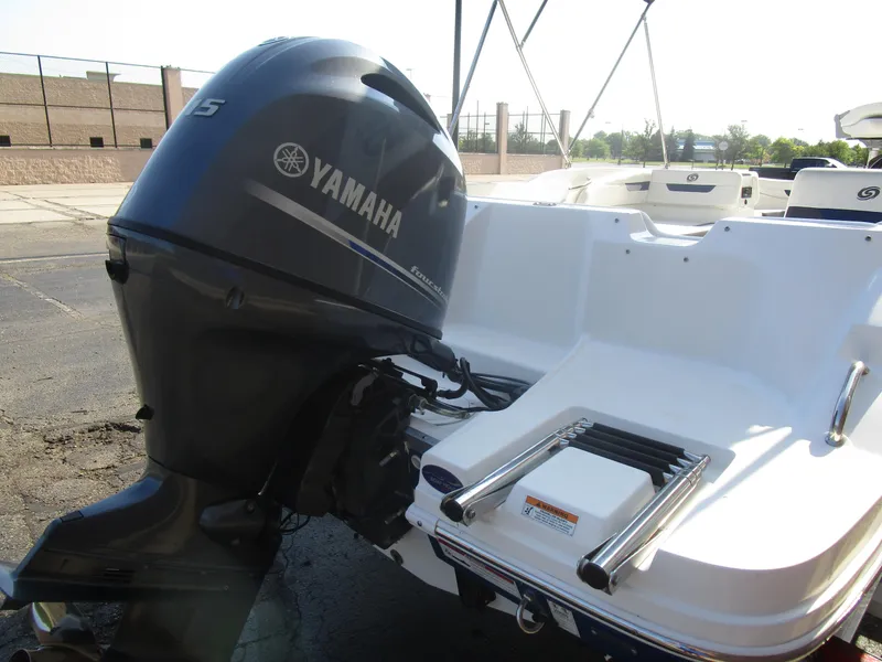 Slide: The Image of 2022 Hurricane SS 185 boat with Yamaha outboard motor, docked on a sunny day. - 12