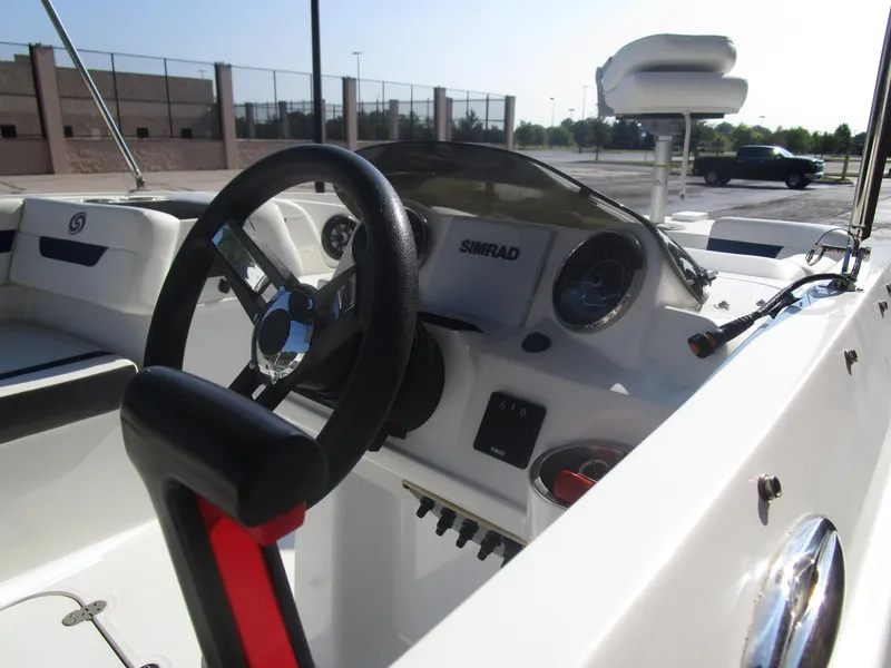 Slide: The Image of 2022 Hurricane SS 185 boat interior with steering wheel and dashboard controls. - 5