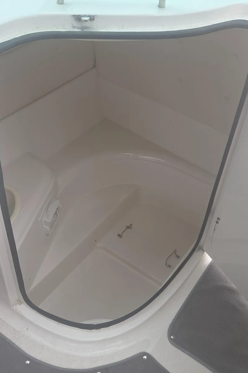 Slide: The Image of 2004 Monterey 233 Explorer boat interior storage compartment. - 13