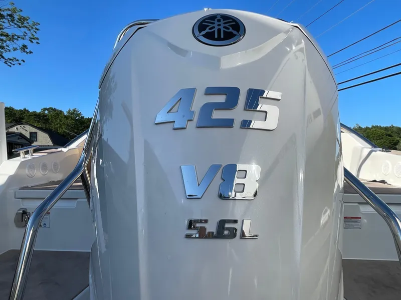 Slide: The Image of Yamarin 88 DC 2023 boat with 425 V8 5.6L engine, clear blue sky background. - 11