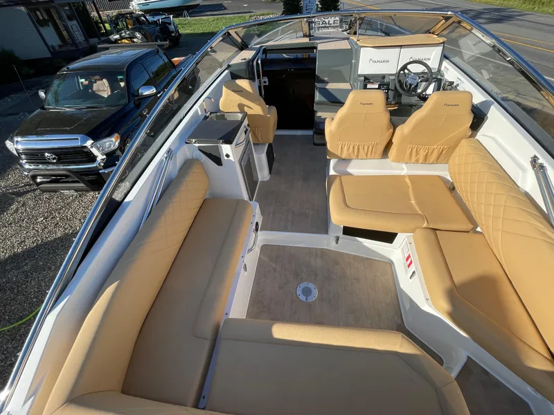 Slide: The Image of 2023 Yamarin 88 DC boat interior with beige seating and modern dashboard. - 14
