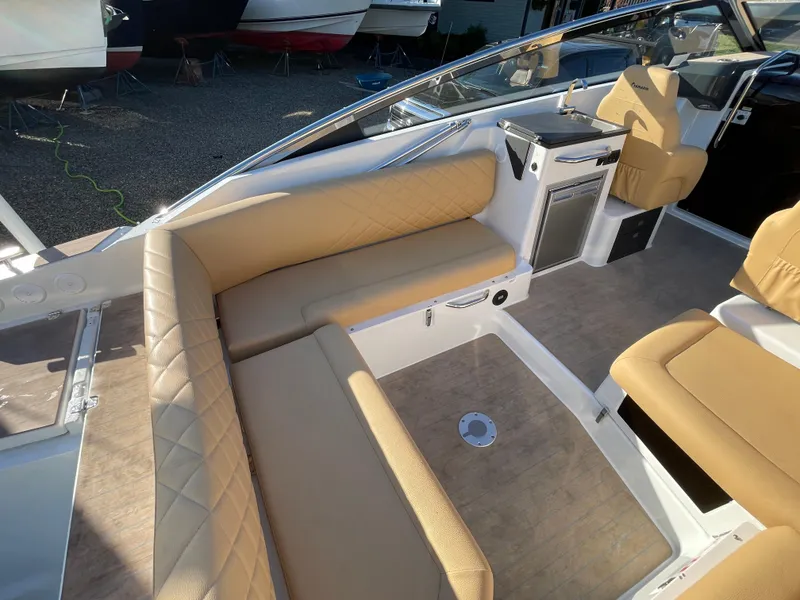 Slide: The Image of Luxurious interior of 2023 Yamarin 88 DC boat with beige seating and modern amenities. - 15