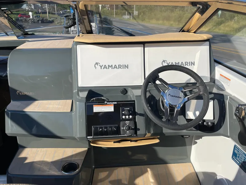 Slide: The Image of 2023 Yamarin 88 DC boat dashboard with steering wheel and control panel. - 21