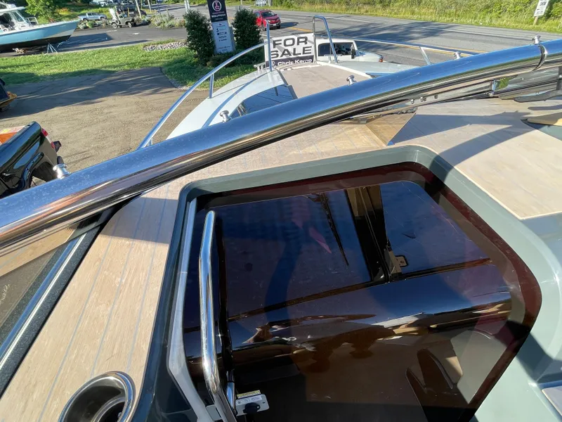 Slide: The Image of 2023 Yamarin 88 DC boat for sale, featuring sleek deck design and modern railing. - 22