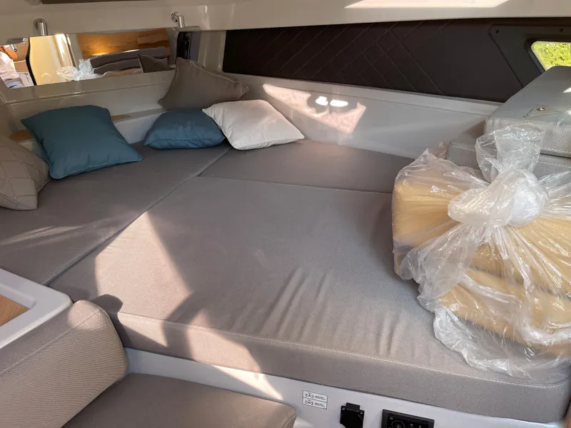 Slide: The Image of Cozy cabin interior of 2023 Yamarin 88 DC boat with cushions and bedding. - 25