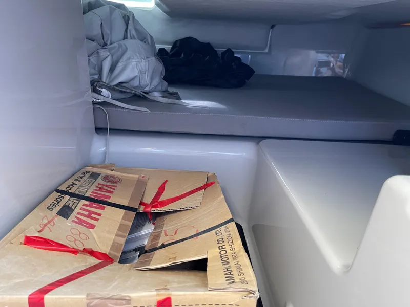 Slide: The Image of Interior cabin of 2023 Yamarin 88 DC boat with storage and seating area. - 26