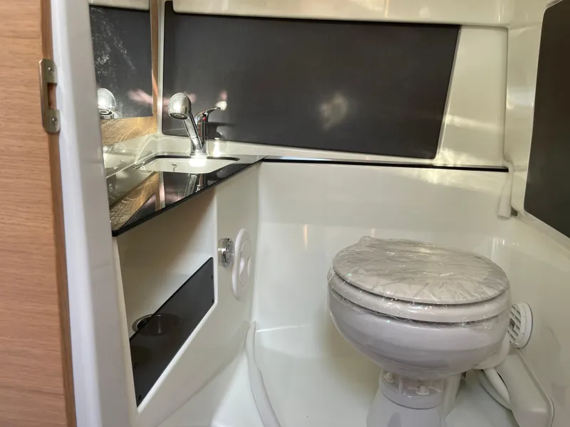 Slide: The Image of 2023 Yamarin 88 DC boat bathroom with sink and toilet. - 28