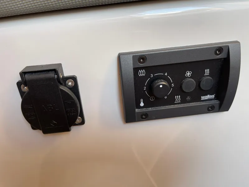 Slide: The Image of Control panel and socket on 2023 Yamarin 88 DC boat interior. - 29