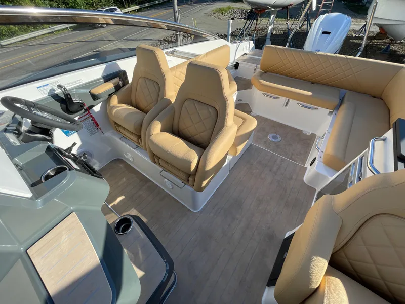 Slide: The Image of Luxurious interior of 2023 Yamarin 88 DC boat with beige seating and modern dashboard. - 33