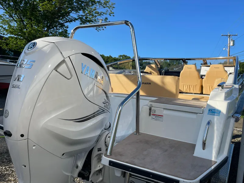 Slide: The Image of 2023 Yamarin 88 DC boat with Yamaha engine, featuring beige seating and sleek design. - 6
