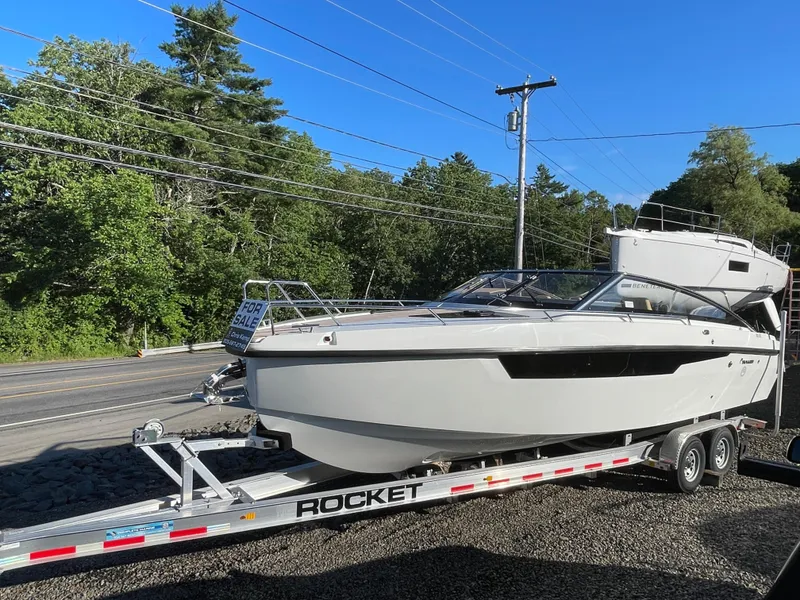 Slide: The Image of 2023 Yamarin 88 DC boat on trailer, for sale, parked roadside. - 9