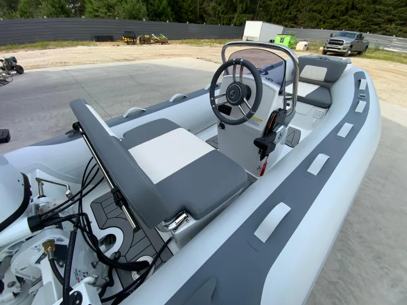 Slide: The Image of 2026 Gala A330L inflatable boat with steering console, gray seating, and modern design. - 4