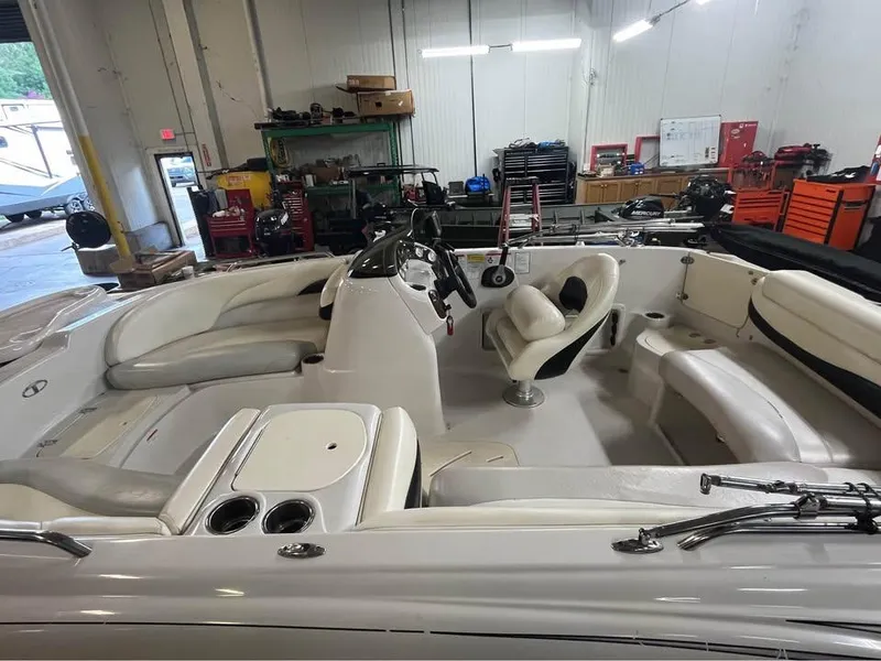 Slide: The Image of 2010 Tahoe 195 Deckboat interior in a workshop setting. - 4