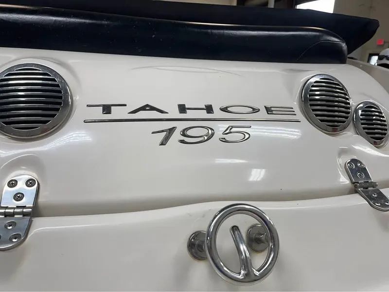 Slide: The Image of 2010 Tahoe 195 Deckboat rear view with logo and ventilation grilles. - 8