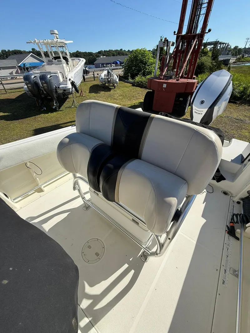 Slide: The Image of 2001 Hydra-Sports 2390 CC Vector boat interior with cushioned seating and outboard motor. - 10