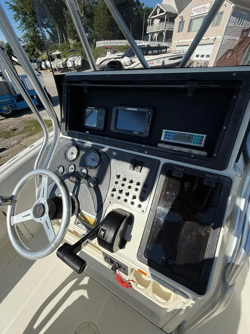 Slide: The Image of 2001 Hydra-Sports 2390 CC Vector boat dashboard with steering wheel and navigation instruments. - 11