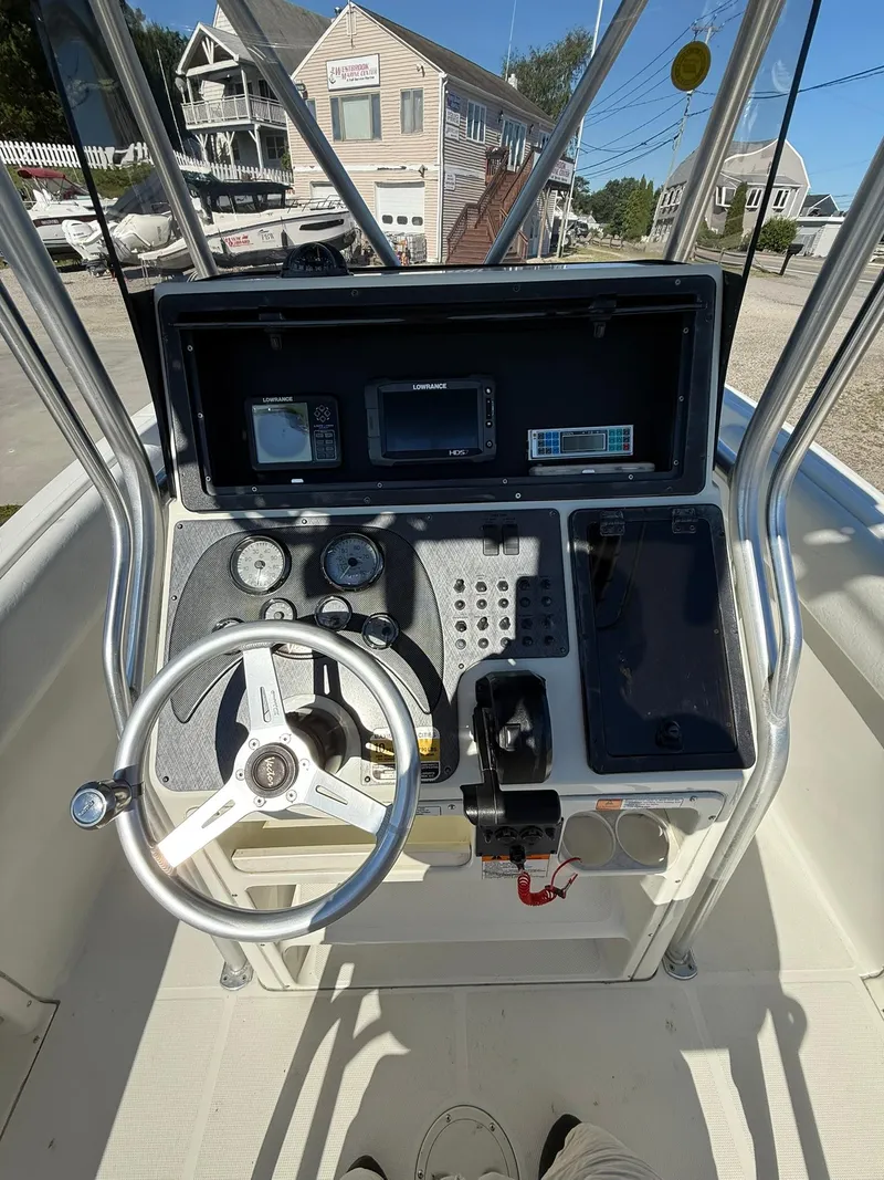 Slide: The Image of 2001 Hydra-Sports 2390 CC Vector boat console with steering wheel and navigation instruments. - 12