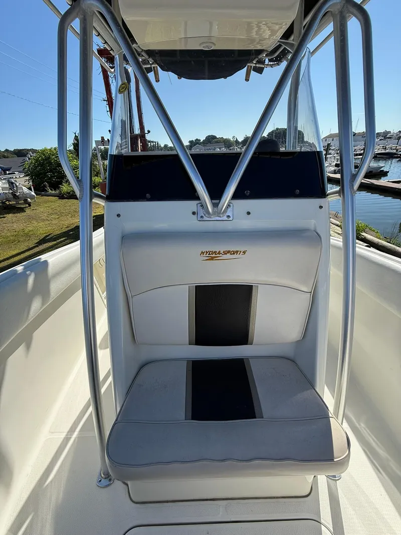 Slide: The Image of 2001 Hydra-Sports 2390 CC Vector boat seat with console and railing, dockside view. - 14