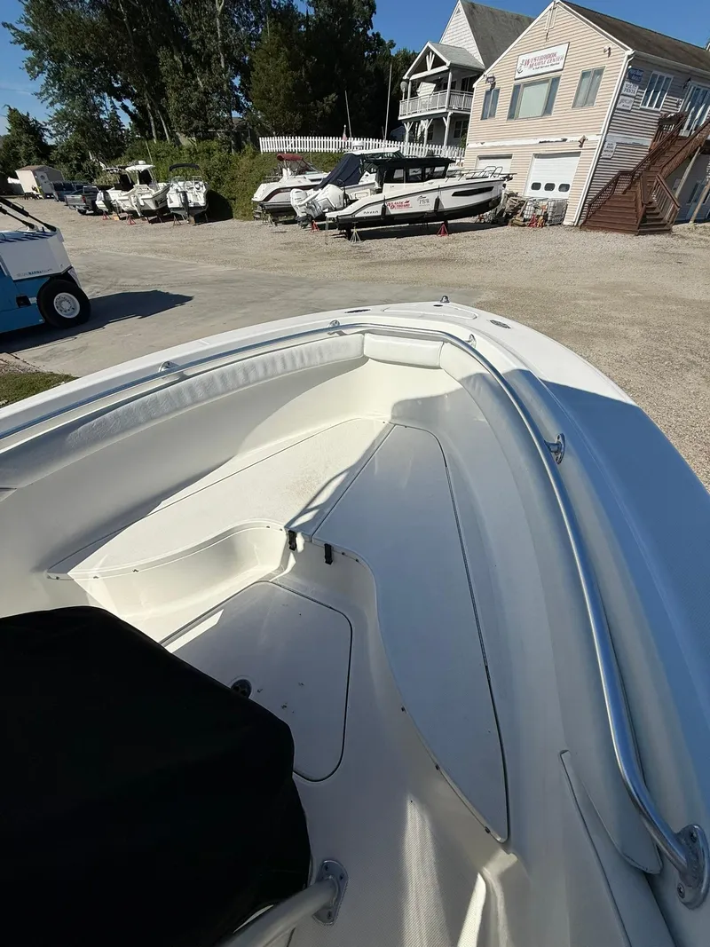 Slide: The Image of 2001 Hydra-Sports 2390 CC Vector boat interior at a marina with other boats. - 15