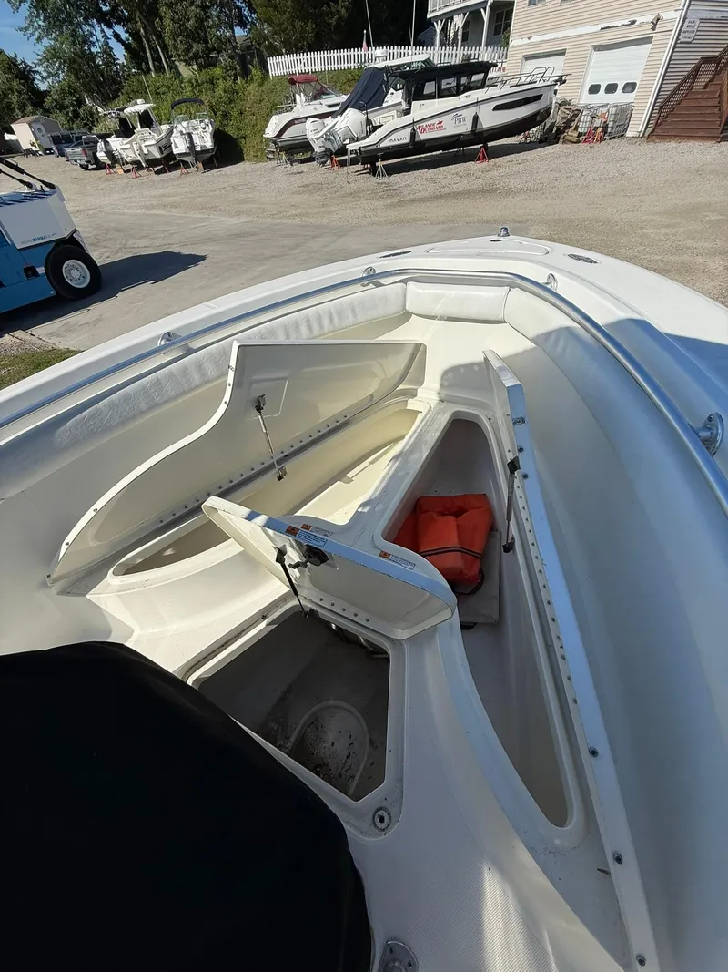Slide: The Image of 2001 Hydra-Sports 2390 CC Vector boat with open storage compartments and life jacket. - 16