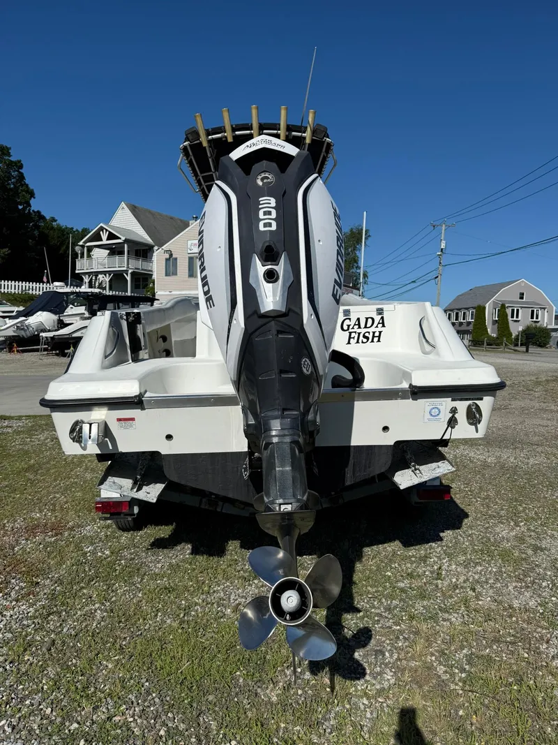 Slide: The Image of 2001 Hydra-Sports 2390 CC Vector boat with Evinrude 200 engine, parked outdoors. - 5