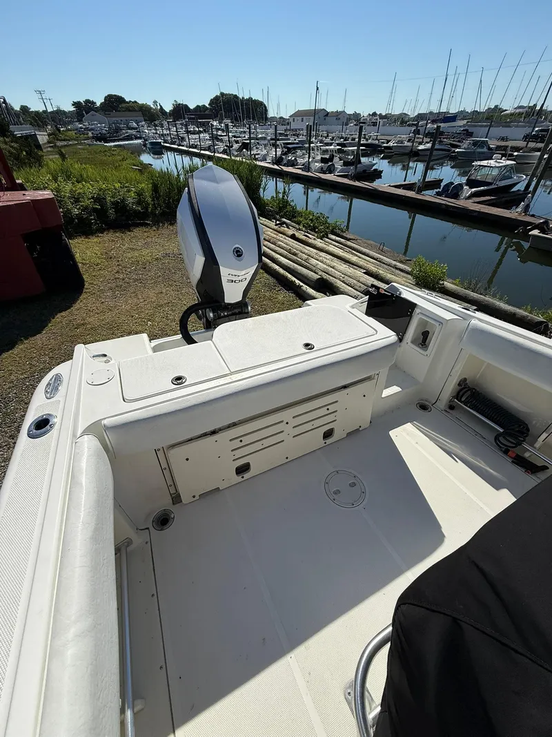 Slide: The Image of 2001 Hydra-Sports 2390 CC Vector boat docked near marina with outboard motor. - 6