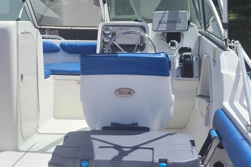 Slide: The Image of 2006 Hydra-Sports 202 DC boat interior with Garmin navigation system and blue seating. - 6